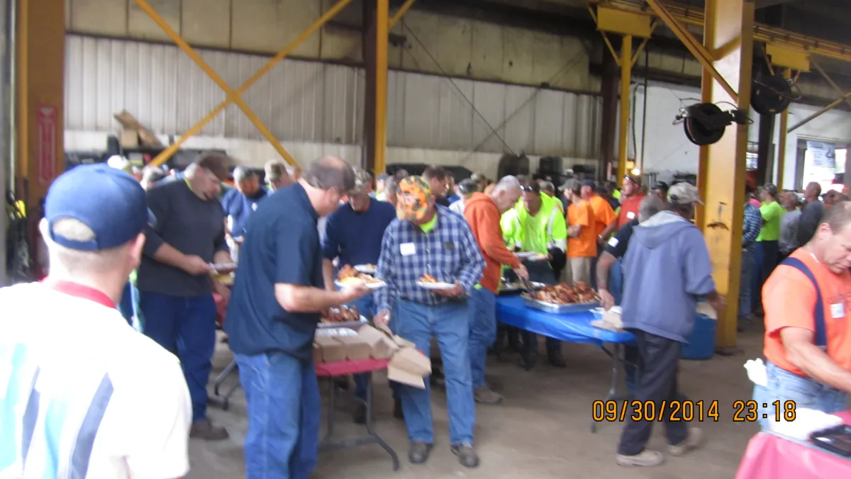 Guests being served at an outdoor Big Belly BBQ event
